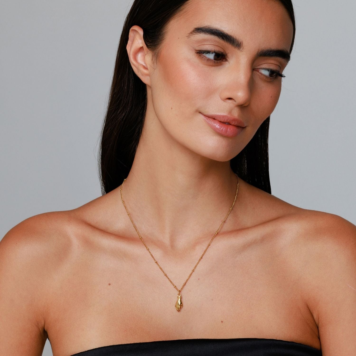 Woman Wearing Guardian Hand Necklace